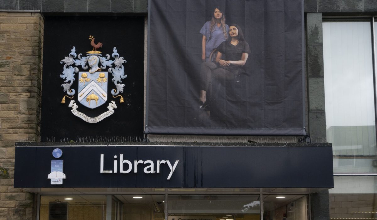 Azraa Motala's Unapologetic banner installed on the exterior of Nelson Library during BTB21