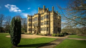 Exterior photo of Gawthorpe Hall on a sunny day