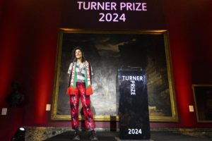 Jasleen Kaur on stage at Tate Britain receiving the Turner Prize