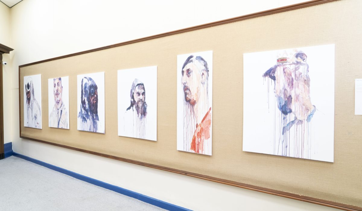 Paintings from The Hoodie Series on display during BTB21